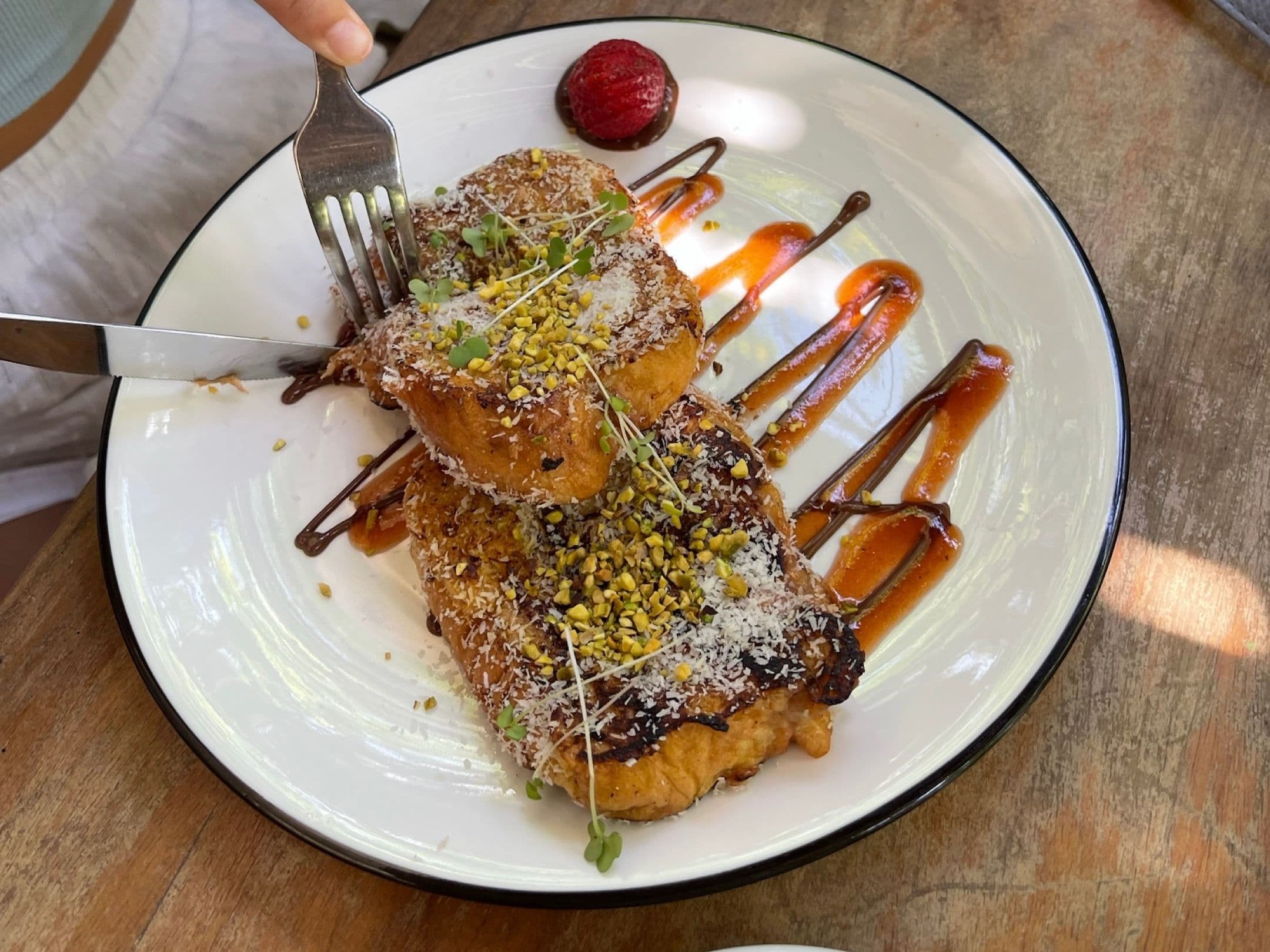 Enjoying guava and pistachio french toast at Flor De Café, Santo Domingo